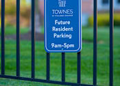 Thumbnail 35 of 50 - a blue parking sign at Townes at Village Center Apartments, Reisterstown, MD, 21136