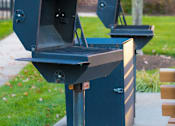 Thumbnail 45 of 50 - two bbq pits on the side of a sidewalk at Townes at Village Center Apartments, Reisterstown, MD