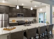 Thumbnail 14 of 23 - Dining table and chair at Siena Luxury Residences, Cinnaminson, NJ