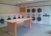 Thumbnail 11 of 14 - Laundry Room at Prince Georgetown Apartments, Riverdale