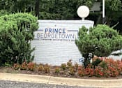 Thumbnail 4 of 14 - A sign that says Prince George Townhomes and Apartments.