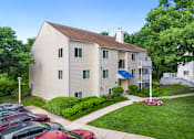 Thumbnail 24 of 24 - A two-story house with a blue awning and a parking lot in front. at West Woods, Maryland, 21401