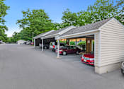 Thumbnail 23 of 24 - A parking lot with a building and cars parked in front. at West Woods, Annapolis, Maryland