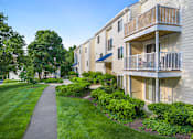 Thumbnail 17 of 24 - A building with a balcony and a walkway in front of it. at West Woods, Annapolis