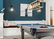 Thumbnail 22 of 35 - A pool table with a lighted billiard light above it. at Spa Cove Apartments, Annapolis, 21403