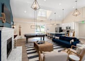 Thumbnail 24 of 35 - A living room with a pool table and a fireplace. at Spa Cove Apartments, Annapolis, 21403