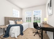 Thumbnail 16 of 20 - A bedroom with a bed, desk, and chair. at Forge Overlook, Halethorpe