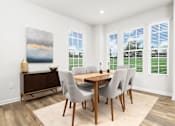 Thumbnail 9 of 20 - A dining room with a wooden table and chairs. at Forge Overlook, Halethorpe