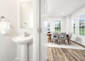 Thumbnail 10 of 20 - A white bathroom with a white sink and a white chair. at Forge Overlook, Halethorpe