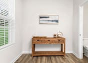 Thumbnail 8 of 20 - A bathroom with a wooden vanity and a painting on the wall. at Forge Overlook, Halethorpe