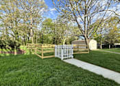 Thumbnail 25 of 26 - A white fence with a gate is in front of a grassy area. at West Woods, Annapolis, Maryland