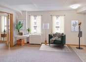 Thumbnail 3 of 14 - A living room with a green couch and a white table.