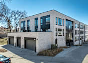 Thumbnail 3 of 19 - A modern building with a mix of white and black exterior.