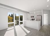 Thumbnail 15 of 19 - A modern kitchen with a white island and a refrigerator.