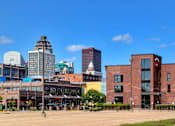 Thumbnail 19 of 35 - A cityscape with a mix of modern and older buildings.