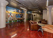 Thumbnail 30 of 35 - A room with a mural of baseball players on the wall.