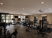 Thumbnail 26 of 35 - A spacious gym with a variety of equipment.