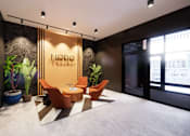 Thumbnail 27 of 34 - A modern office space with a NODO sign on the wall.
