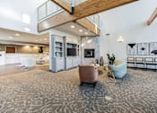 Thumbnail 23 of 52 - Modern clubhouse featuring community lounge, coffee bar, salon and spa, billiards and poker room, and concierge package room at Parkside Apartments and Shops in Bentonville, AR