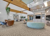 Thumbnail 20 of 52 - Modern clubhouse featuring community lounge, coffee bar, salon and spa, billiards and poker room, and concierge package room at Parkside Apartments and Shops in Bentonville, AR
