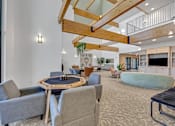 Thumbnail 19 of 52 - Modern clubhouse featuring community lounge, coffee bar, salon and spa, billiards and poker room, and concierge package room at Parkside Apartments and Shops in Bentonville, AR
