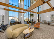 Thumbnail 21 of 52 - Modern clubhouse featuring community lounge, coffee bar, salon and spa, billiards and poker room, and concierge package room at Parkside Apartments and Shops in Bentonville, AR