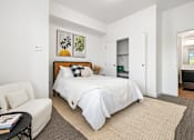Thumbnail 10 of 52 - Upscale studio, one, and two-bedroom apartment homes featuring two-tone kitchen cabinetry, quartz countertops, stainless steel appliances, luxury vinyl wood flooring, and much more at Parkside Apartments and Shops in Bentonville, AR