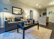 Thumbnail 2 of 19 - a living room with a couch and a coffee table