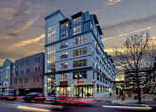 Thumbnail 9 of 21 - an evening view of a blue building on a city street at 520 Lofts, Allentown, PA