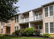 Thumbnail 2 of 22 - A brick apartment building with a balcony on the second floor. at Brookfield Apartments, Pennsylvania