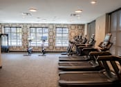 Thumbnail 4 of 26 - A gym with treadmills and elliptical machines at The Hive Apartments, Allentown, PA, 18101