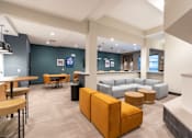 Thumbnail 16 of 26 - A modern office space with a variety of seating options. at The Hive Apartments, Pennsylvania