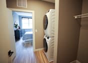 Thumbnail 7 of 15 - A white dryer is in a laundry room.