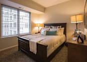 Thumbnail 3 of 10 - a bedroom with a large bed and a window