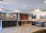 Thumbnail 2 of 43 - A room with a pool table and bar area.