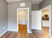 Thumbnail 14 of 35 - A room with a white door leading to a kitchen at The Standard Apartments, Allentown, PA, 18101
