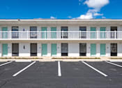 Thumbnail 18 of 21 - an empty parking lot in front of a building with balconies at The Teale Navy Yard, North Charleston, 29405