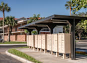 Thumbnail 24 of 58 - A row of mailboxes are lined up under a roof.
