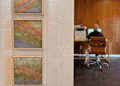 Thumbnail 3 of 16 - Three landscape paintings are hanging on a white wall. at The Teale Siesta Lago in Kissimmee, FL, 34746