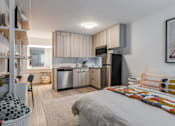 Thumbnail 8 of 11 - a studio apartment with a bed and a kitchen at The Teale, Kissimmee, FL, 34746