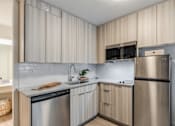 Thumbnail 3 of 11 - our apartments offer a modern kitchen with stainless steel appliances at The Teale, Kissimmee, FL, 34746