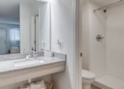 Thumbnail 6 of 11 - a bathroom with a sink and a shower and a mirror at The Teale, Kissimmee, FL, 34746