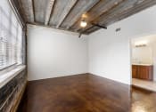 Thumbnail 15 of 40 - an empty room with a large window and white walls