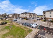 Thumbnail 35 of 40 - the preserve at ballantyne commons apartments exterior view of parking lot and buildings