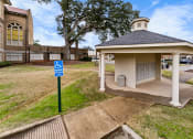 Thumbnail 6 of 40 - a handicapped accessible bathroom in front of a church with a blue handicapped sign