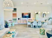 Thumbnail 7 of 11 - a living room with a table and chairs and a television at The Teale, Kissimmee, FL, 34746