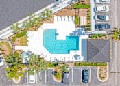 Thumbnail 11 of 11 - an overhead view of a pool in a parking lot with cars at The Teale, Kissimmee, FL, 34746
