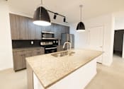 Thumbnail 35 of 38 - a kitchen with a sink and a counter top in a house  at The Lady, Columbia