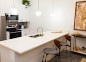 Thumbnail 6 of 38 - a kitchen with a white counter top and a sink  at The Lady, Columbia, SC, 29201