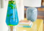 Thumbnail 8 of 20 - A blue and green lamp on a yellow table.at The Teale New Haven Apartments, Melbourne, FL, 32904
